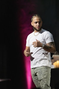 a man standing on stage with a microphone